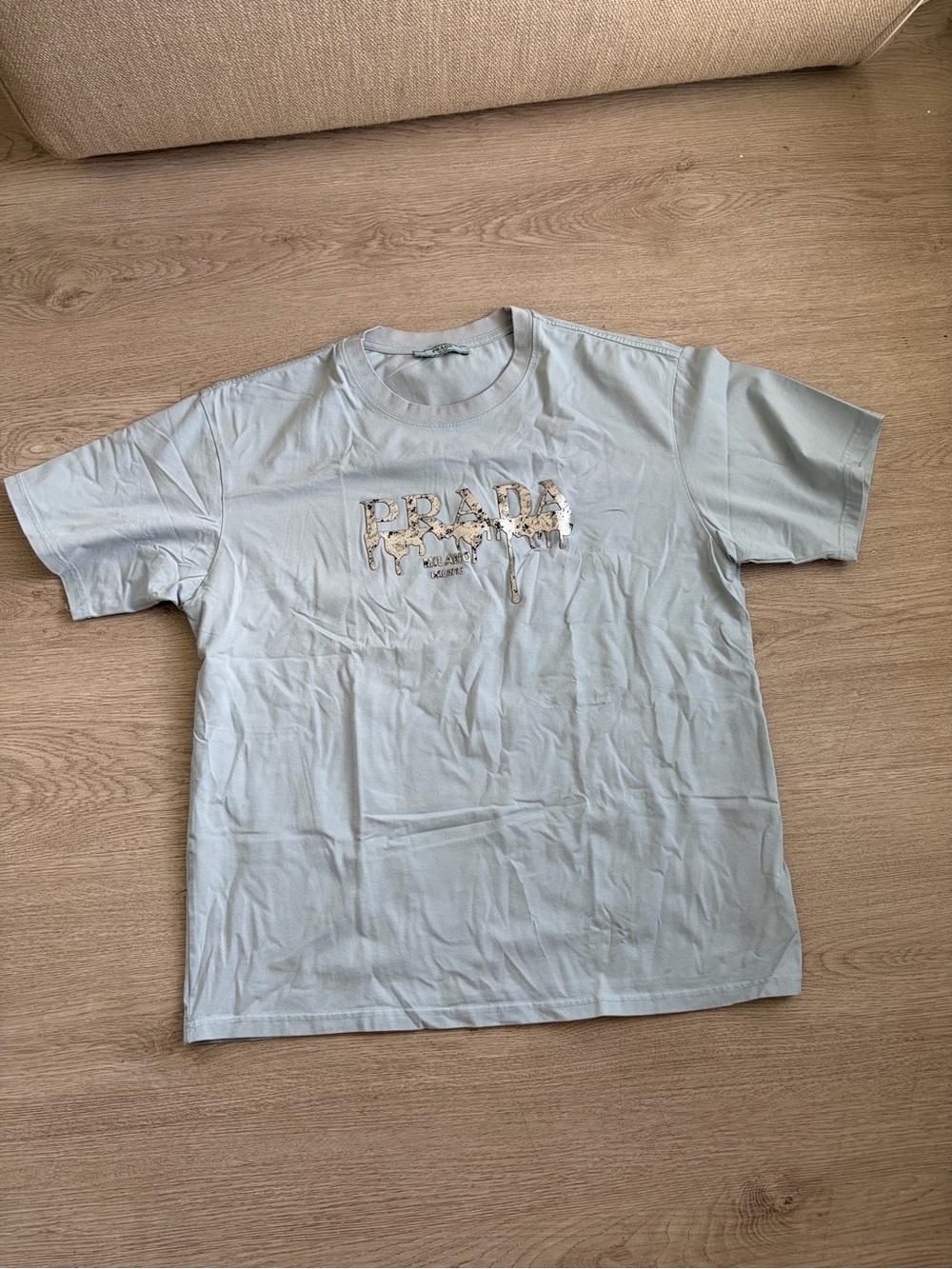 Prada Pale Blue T-Shirt with Metallic Logo Drip
